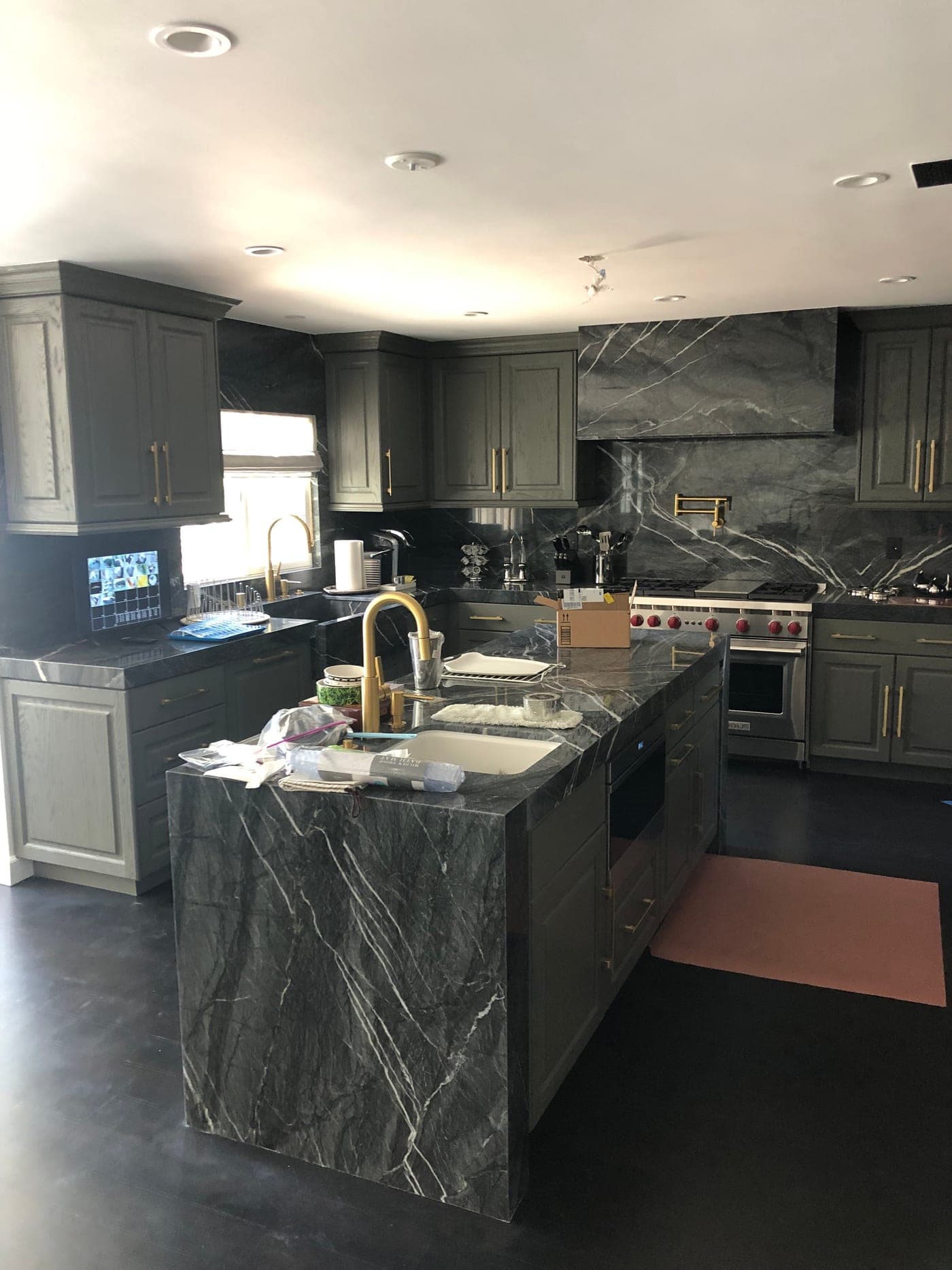 Beverly Hills kitchen by Accelerate Construction with custom gray cabinetry and a marble island