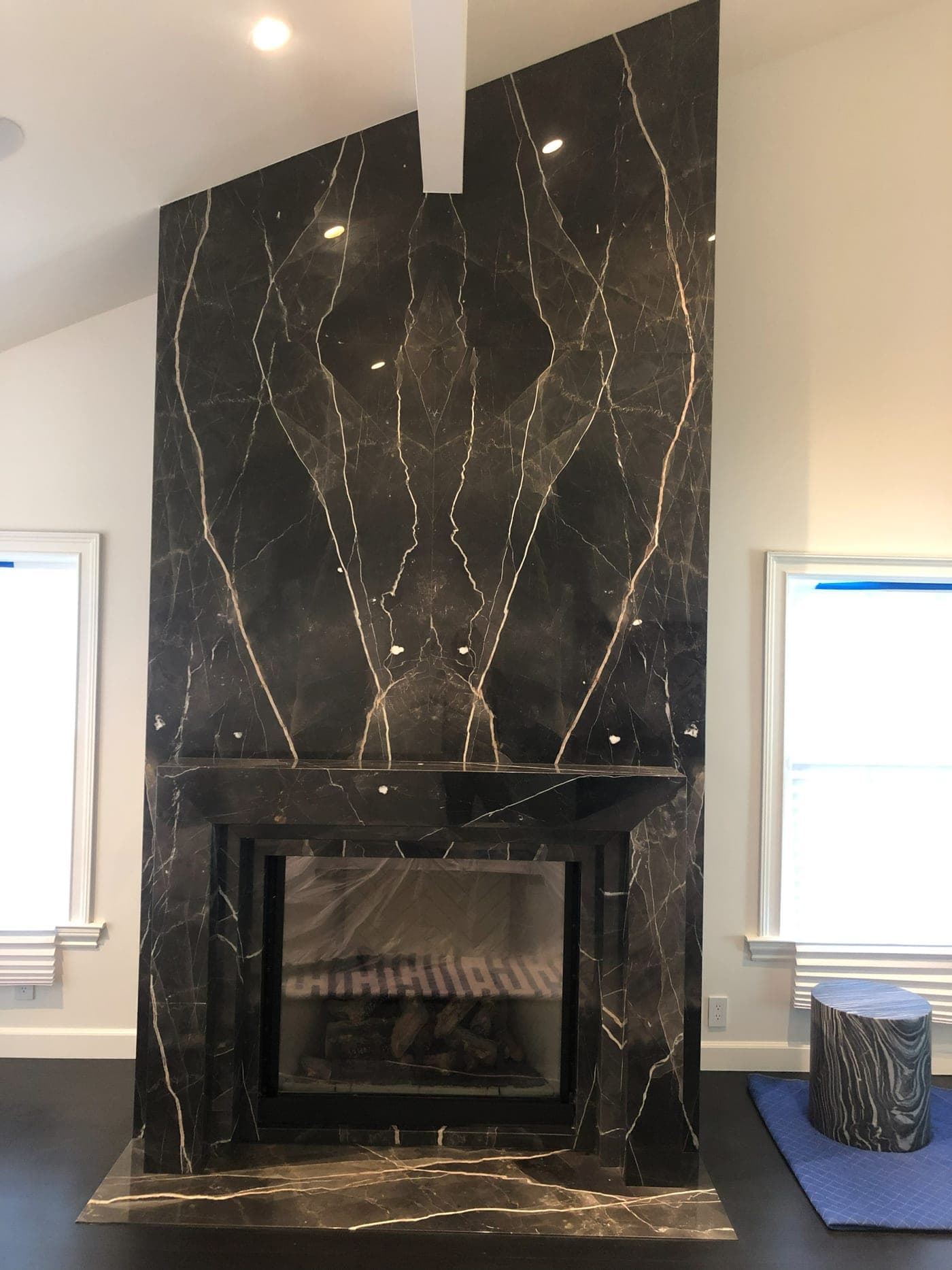 Book-matched marble fireplace and feature wall in Beverly Hills by Accelerate Construction