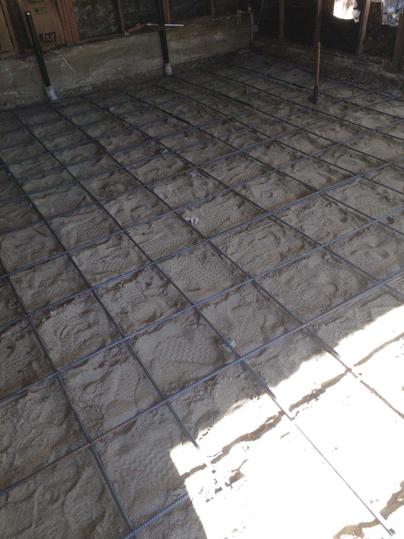 Reinforcing steel laid for a new concrete slab inside the West Hollywood garage